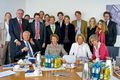 Photograph of Rohde & Schwarz partners/owners family members, taken in year 2009. From left standing: first is Dr. Christina Rohde (Daughter of Dr. Ulrich L. Rohde), second is Dr. Ulrich L. Rohde, from left sitting on chair, first is Mr. Friedrich Schwarz, second is Dr. Ulrich Rohde’ sister. Rohde & Schwarz was founded 85 years ago by university friends Dr. Lothar Rohde and Dr. Herman Schwarz and is headquartered in Germany, Munich. As an independent, privately owned company, Rohde & Schwarz generates its growth from its own resources. Since the company does not have to think in terms of quarterly results, it can plan for long term. Rohde & Schwarz has approximately 12,000 employees, about 7000 of who work in Germany.