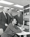 1641 - Ernst Weber and others at an IBM 7040.jpg