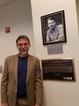 Brian Berg, R6-Milestone Coordinator, with a 2nd CP/M plaque at the dedication of the Gary Kildall Conference Room at the Naval Postgraduate School, Monterey, CA