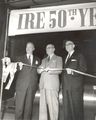 Alfred N. Goldsmith, IRE founder, cutting ribbon opening convention, with P. E. Haggerty (IRE Pres) and George W. Bailey (Convention Chairman)