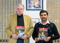 The photo is taken in October 2013 at Synergy Microwave Corp., New Jersey, depicting from left Dr. Ulrich Rohde and Dr. Ajay Poddar; holding Microwave Journal cover page of Magazine, highlights the invention of Metamaterial Mobius Strips for resonator and sensor applications.
